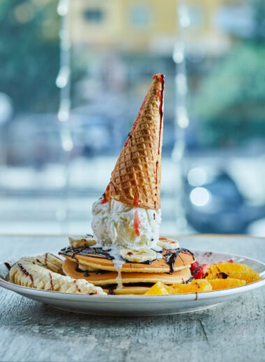 Ice Cream Cone Pancake Stack with Fresh Fruits and Chocolate Drizzle